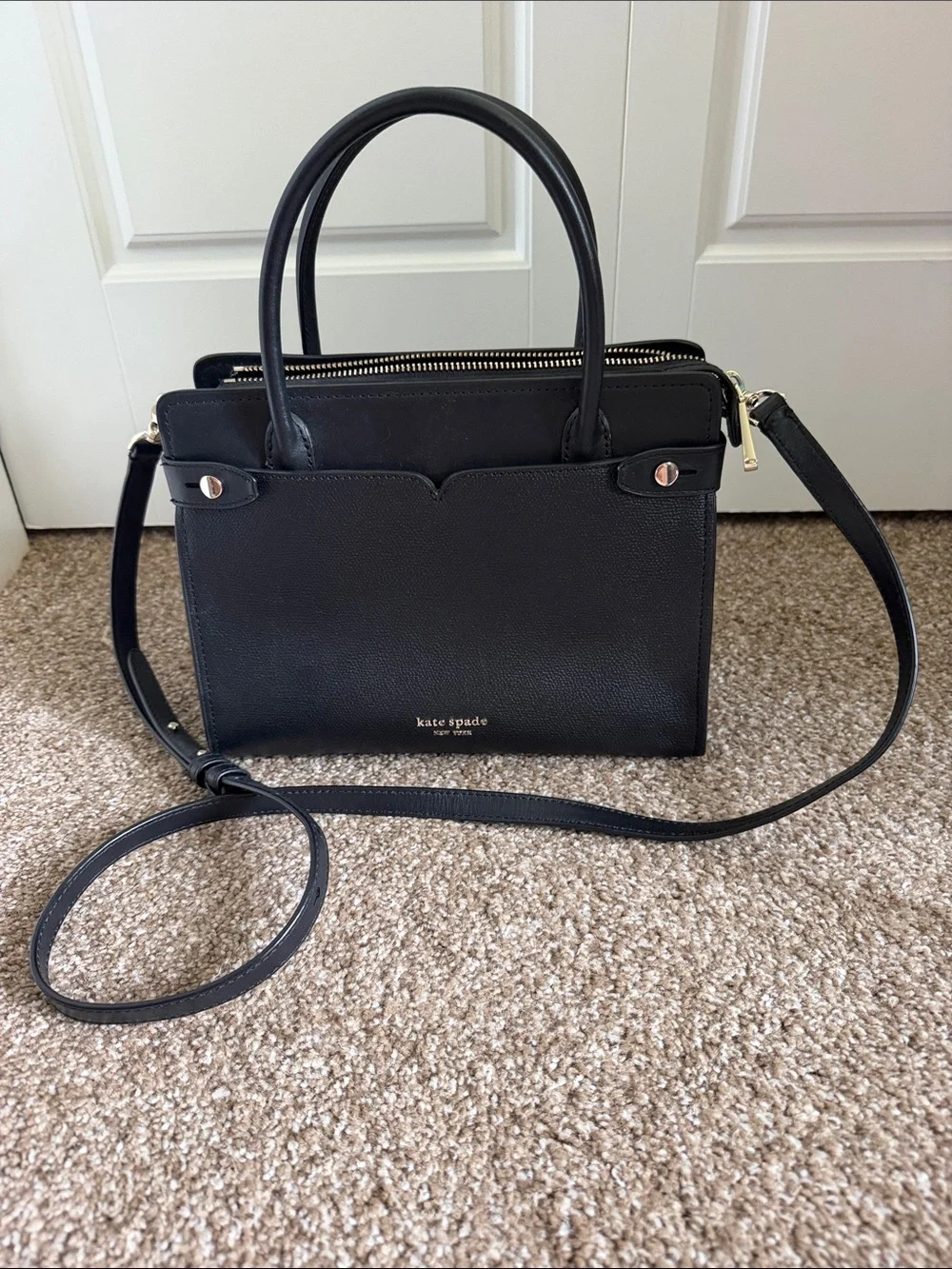 kate spade black leather satchel with gold hardware accents